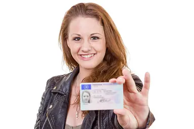 young-woman-showing-her-drivers-license.png
